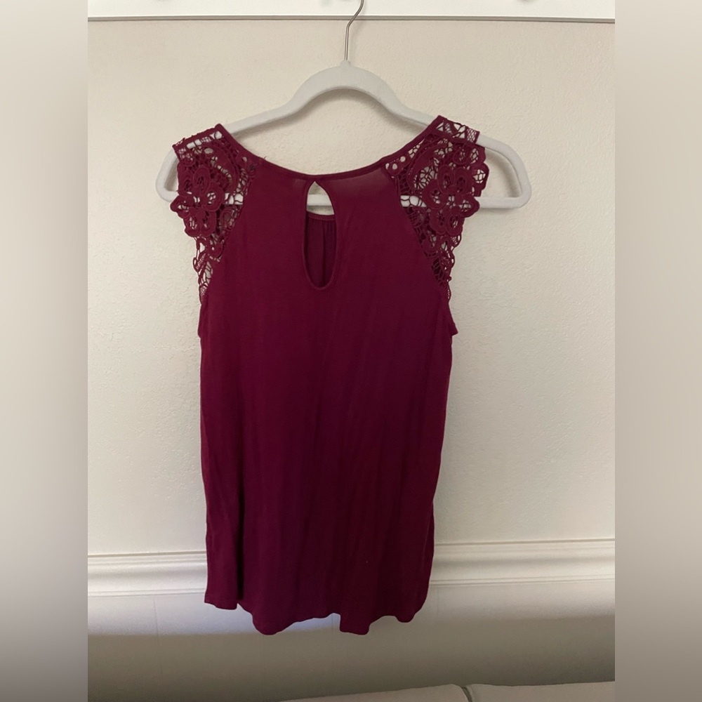 Maroon blouse.